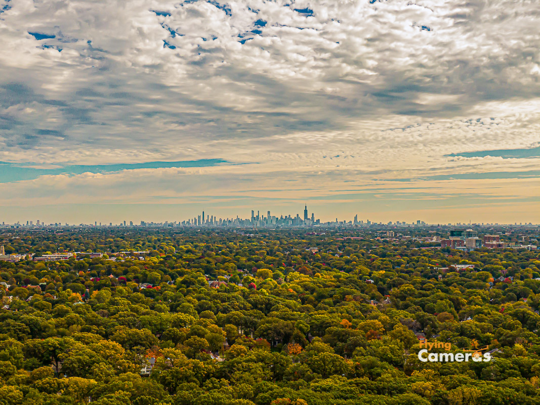 Aerial view 300' altitude of Chicago skyline 25 miles in the distance on a fall day