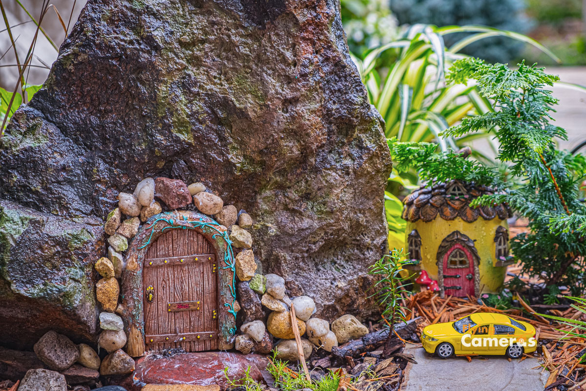 Closeup of imaginary fairy garden homes