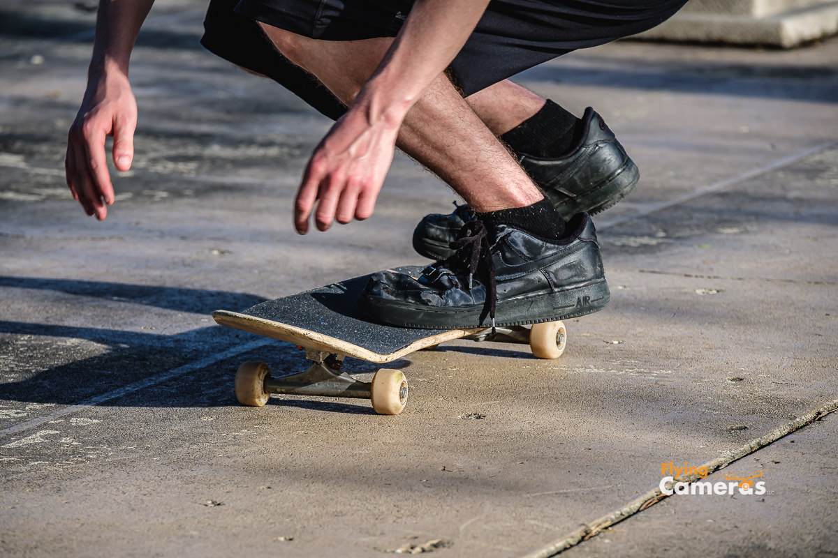 Teen balancing on skateboard after completing a kick flip